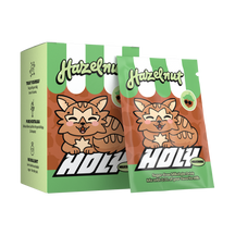 Pappbox mit einem Probepackung, beide mit einem niedlichen Tiermotiv und der Aufschrift "Hazelnut" dekoriert.
