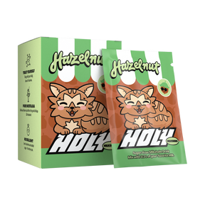 Pappbox mit einem Probepackung, beide mit einem niedlichen Tiermotiv und der Aufschrift "Hazelnut" dekoriert.