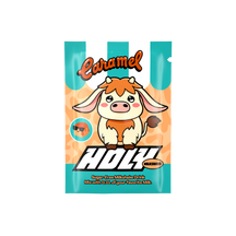 Sachet mit Karamell-Milchshake-Thema, zeigt eine Cartoon-Kuh auf gestreiftem Hintergrund.